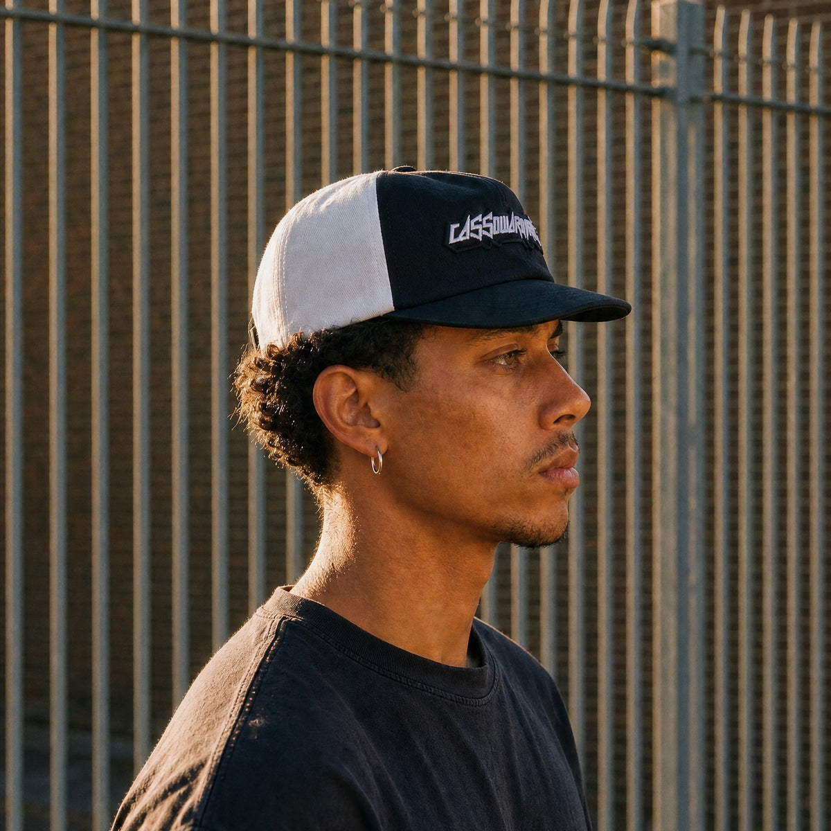 Cassowary Drive 2 Tone Logo Cap — side profile worn, golden hour