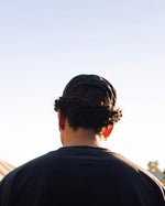 Cassowary Drive Short Brim Logo Hat — rear view showing snapback fit