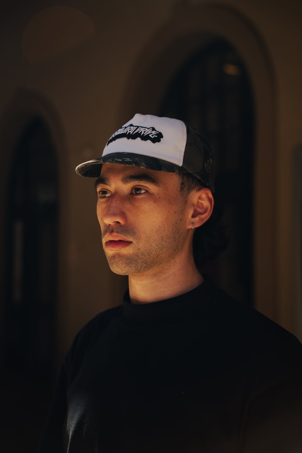 Cassowary Drive V2 Camo Short Brim — worn, front three quarter view